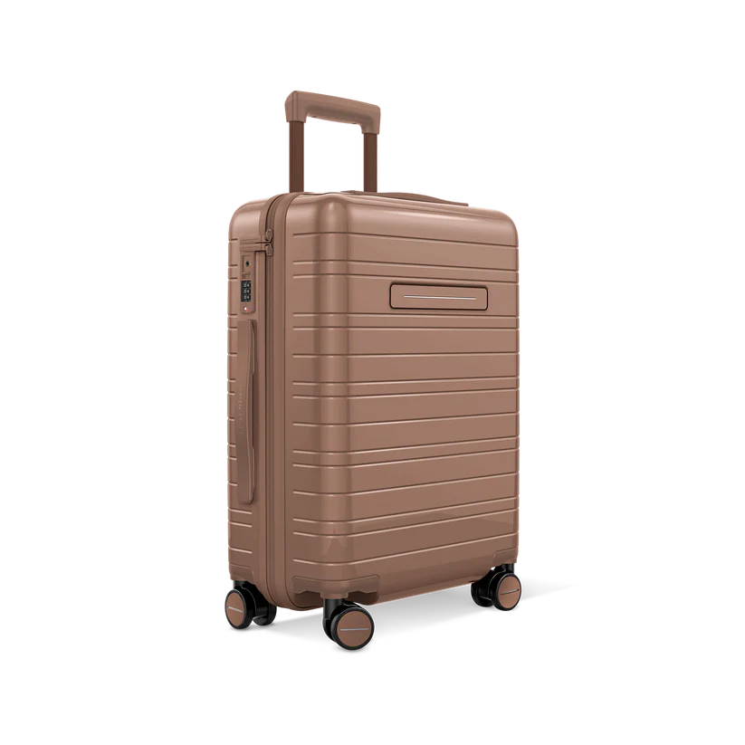 Horizn Studios H5 RE glossy mocha cabin suitcase with four wheels and modern design, shown from a three-quarter angle.